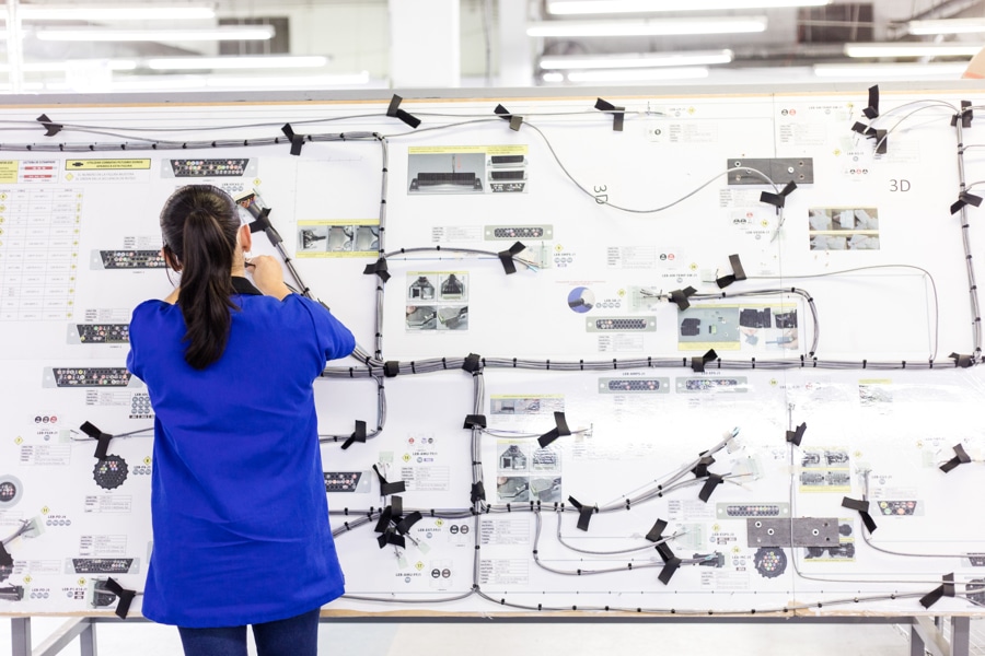 Electromechanical Engineer uses harness peg board as a cable assembler