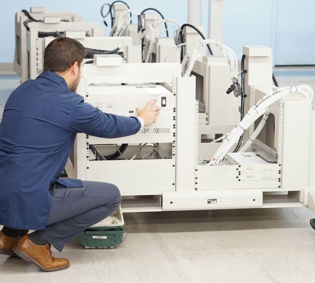 Electrical Engineer inspects Box Build PDU for Semiconductor Capital Equipment