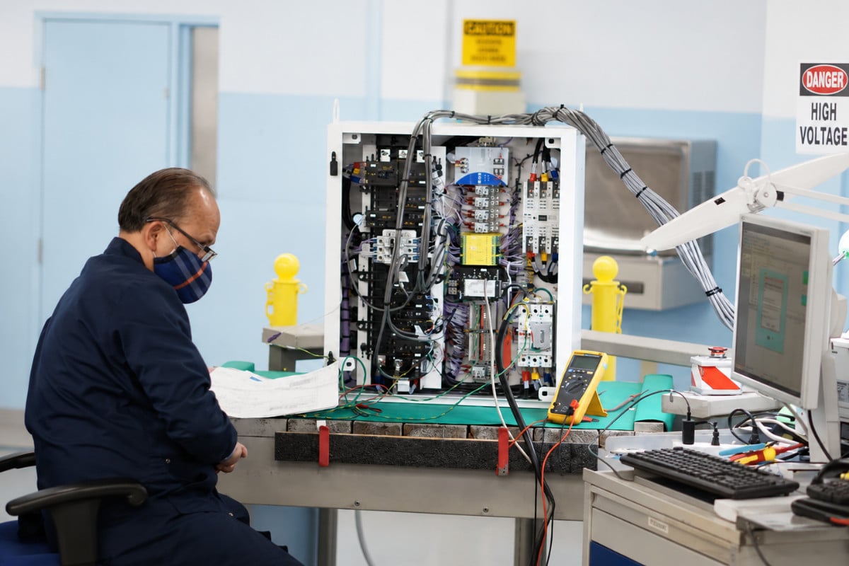 Federal Elec Blog-18 Graphic-05 Engineer performing system integration and functional testing under documented ISO quality processes.